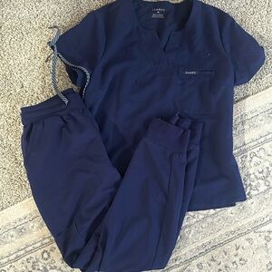 Navy Jaanuu size medium scrub top and bottoms